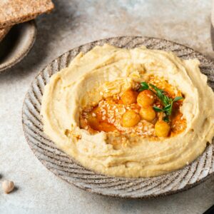 Hummus with crispbread. Healthy snack. Vegetarian food. Chickpea hummus